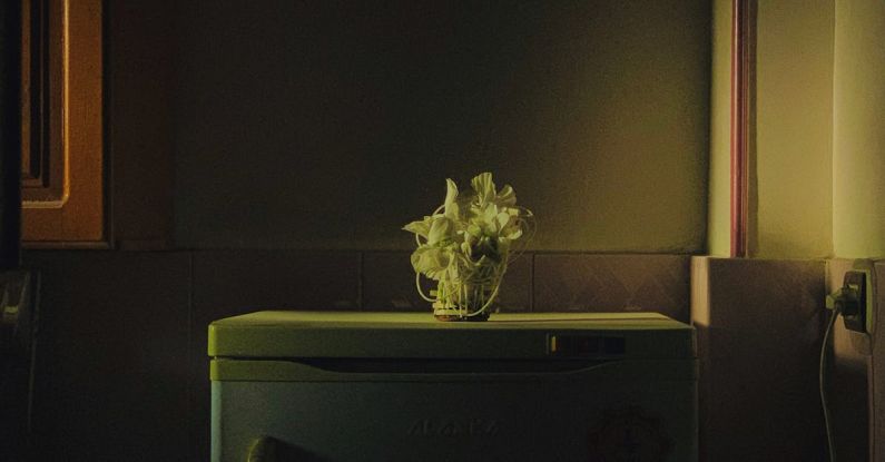 Smart Fridge - A small vase of flowers on a refrigerator