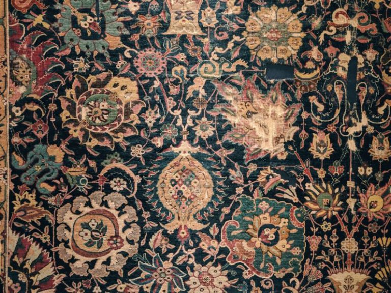 Area Rug - a large rug with many different colors and designs