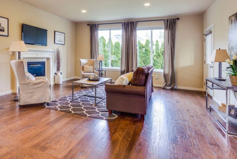 Hardwood Floors - a living room filled with furniture and a fire place