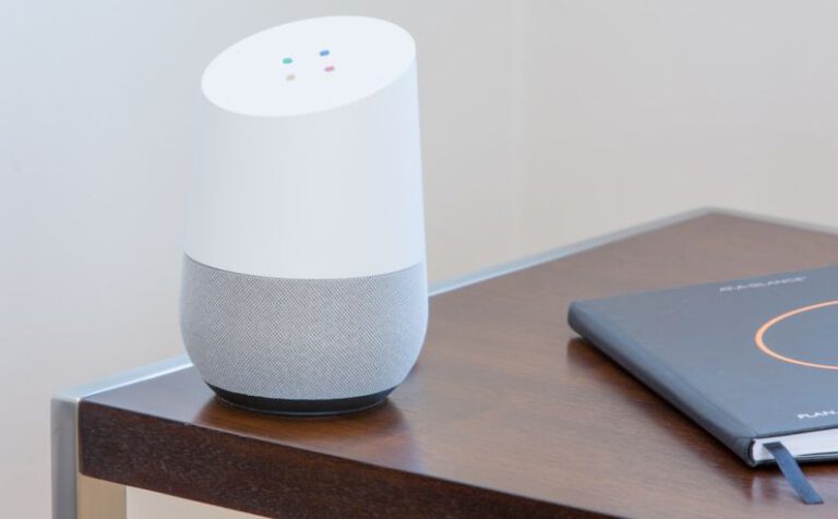 Home Automation - white and gray Google home on brown table