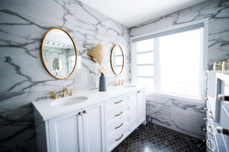 Bathroom Renovation - a bathroom with two sinks and a large mirror